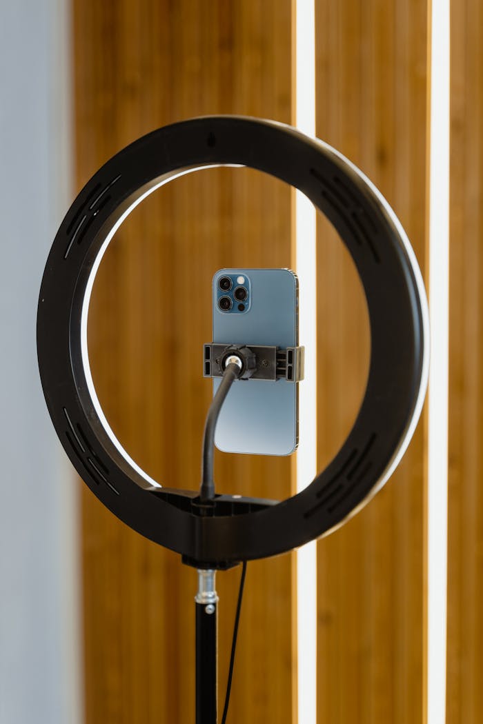 hero-img Smartphone mounted on ring light, perfect for content creators using mobile devices.